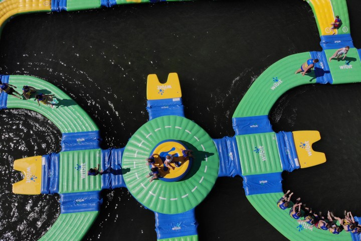 An aerial view of kids playing on the water park