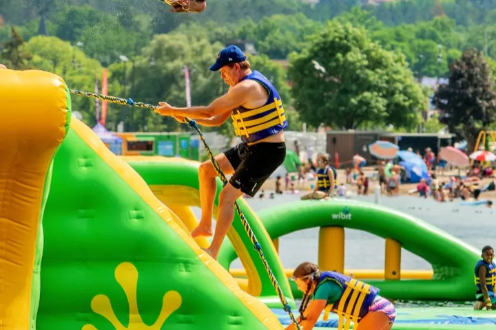 a person riding on the back of a boat