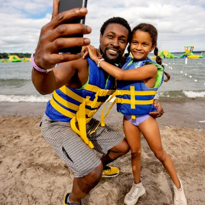 a young boy standing on a beach