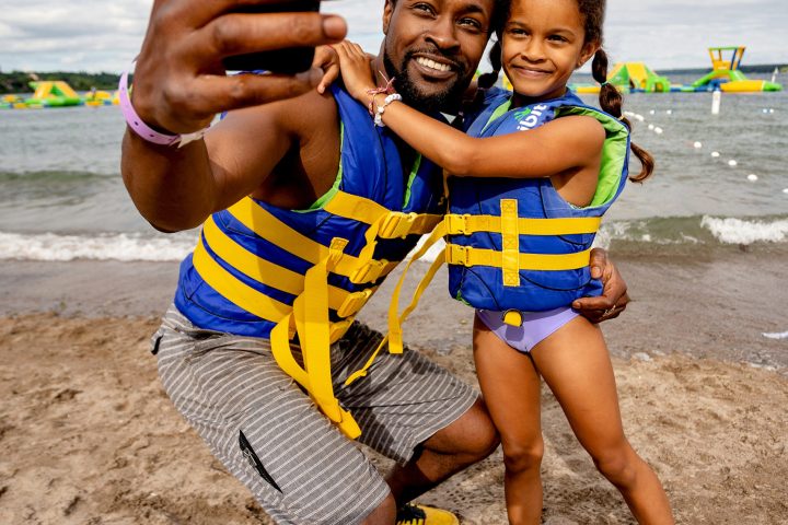 a young boy standing on a beach