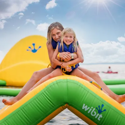 a woman sitting at a beach