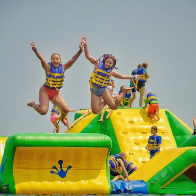 a group of people sitting at a beach