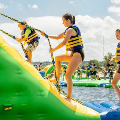a group of people riding on the back of a boat