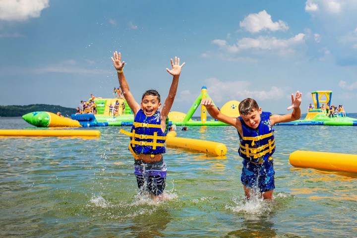 a group of people on a raft in a body of water