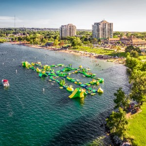 a body of water with a city in the background