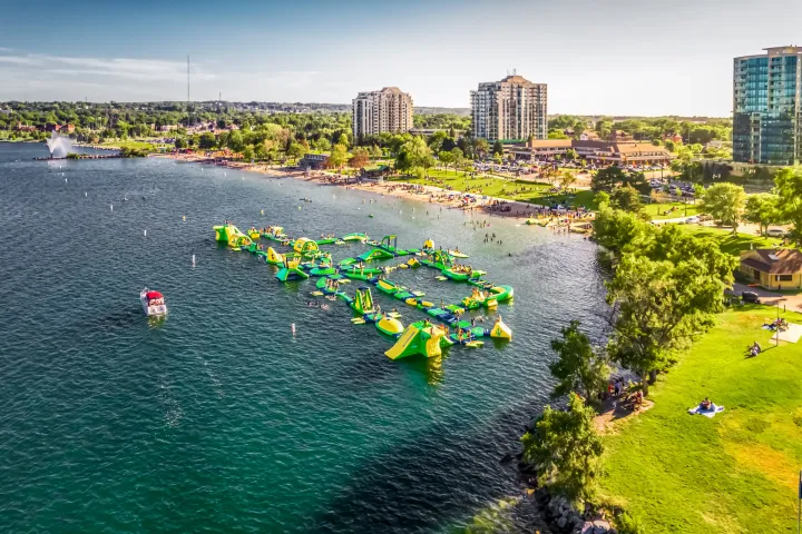 a body of water with a city in the background