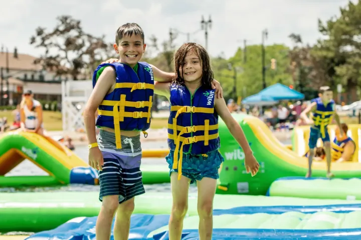 a group of people riding on the back of a boat