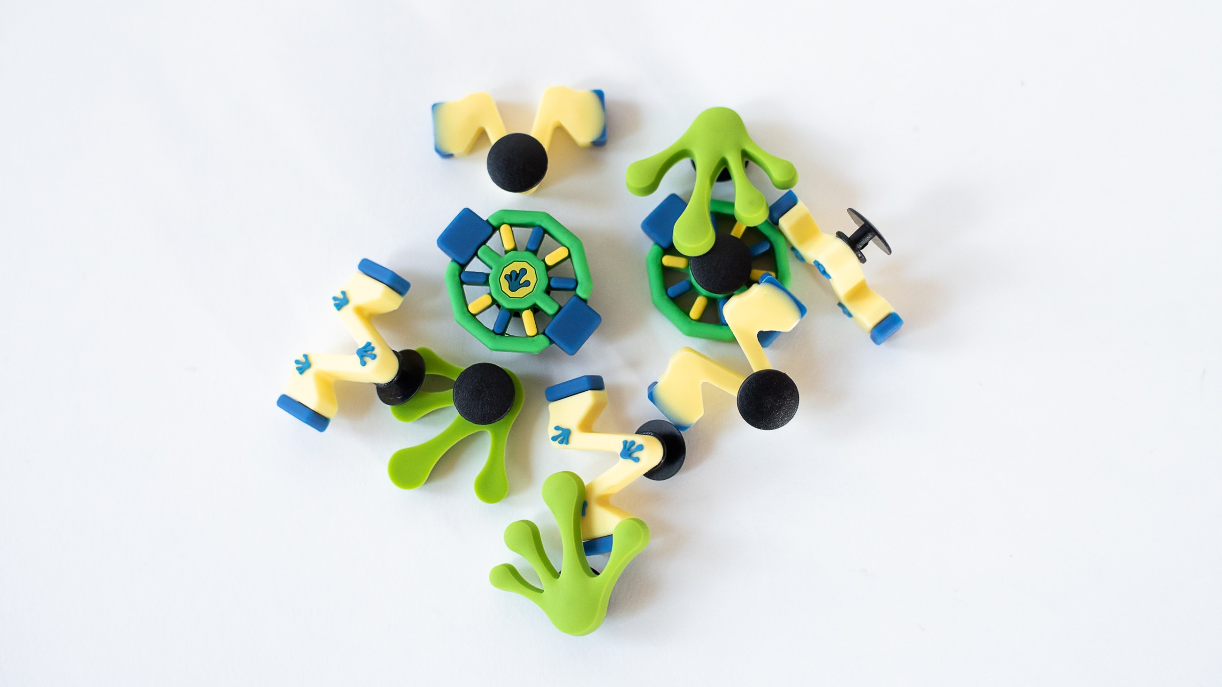 Colorful mechanical components on white background.